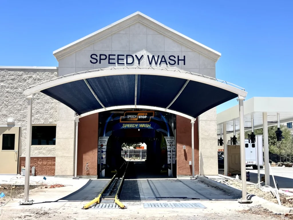 Arched entrance canopy at a Speedy Wash car wash