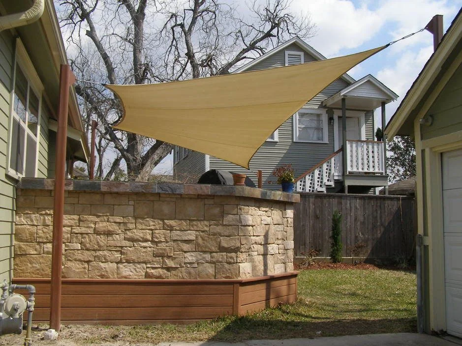 Shade sail over an outdoor patio seating area