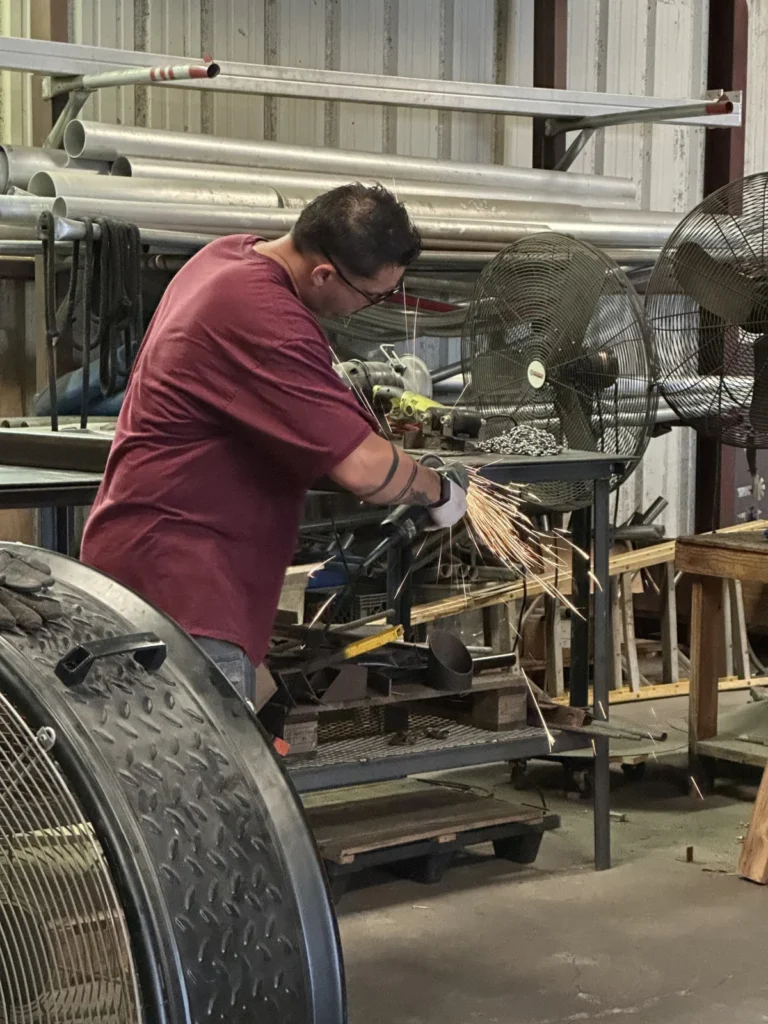 Welder fabricating steel components in the Houston shop